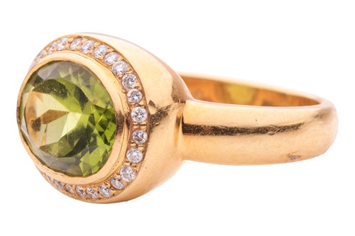 Lot 19 - A peridot and diamond cluster ring by Kiki...