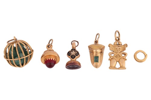 Lot 9 - A collection of five charms; to include a...