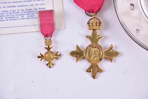 Lot 2 - A gilt metal O.B.E. medal on red ribbon...