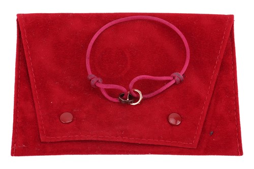 Lot 77 - Cartier - a 'Love Charity' bracelet, featuring...