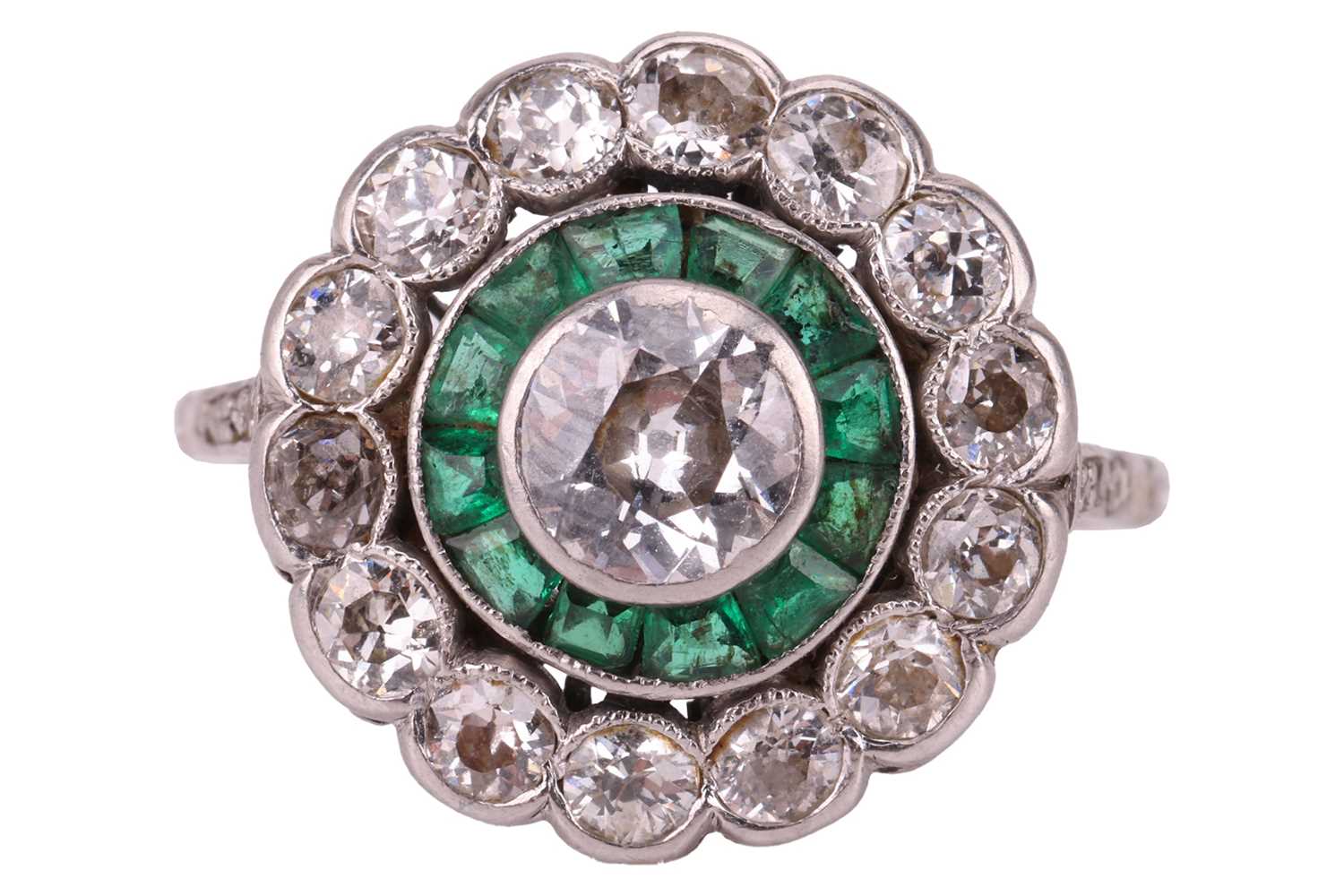 Lot 240 - An Art Deco diamond and emerald target ring,...