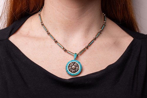Lot 237 - A Victorian gem-set pendant on chain; the...