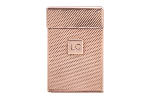 Lot 312 - Cartier - a 9ct gold lighter, of upright...