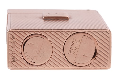 Lot 312 - Cartier - a 9ct gold lighter, of upright...
