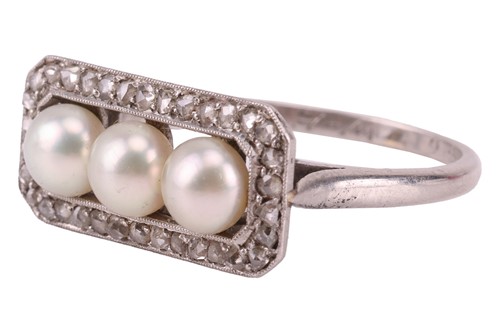 Lot 63 - An early 20th Century pearl trilogy ring; the...
