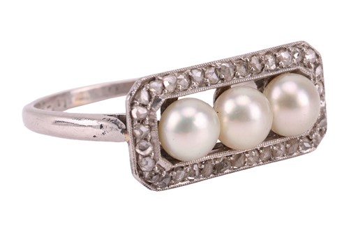 Lot 63 - An early 20th Century pearl trilogy ring; the...