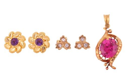 Lot 25 - A pendant and two pairs of earrings; the...