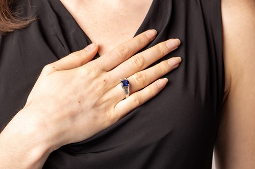 Lot 105 - A sapphire and diamond ring, comprising a...
