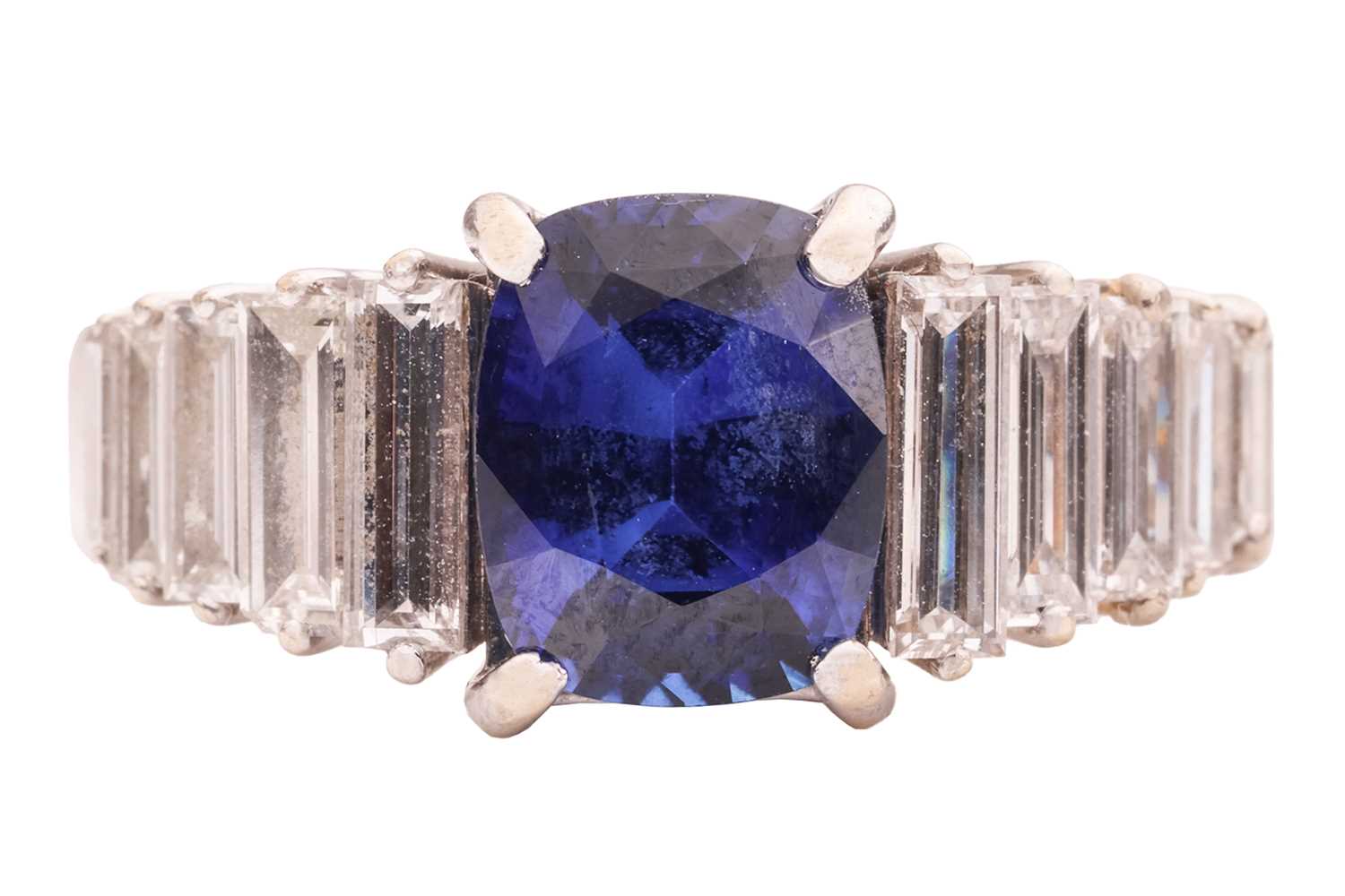Lot 105 - A sapphire and diamond ring, comprising a...