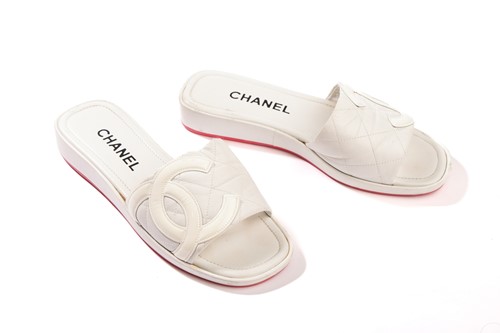 Lot 143 - Chanel - a pair of CC Cambon flat slides in...