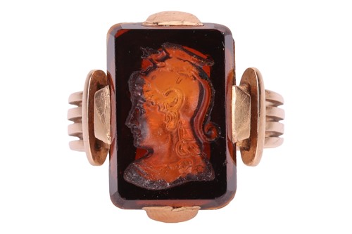 Lot An obsidian intaglio ring, the rectangular...