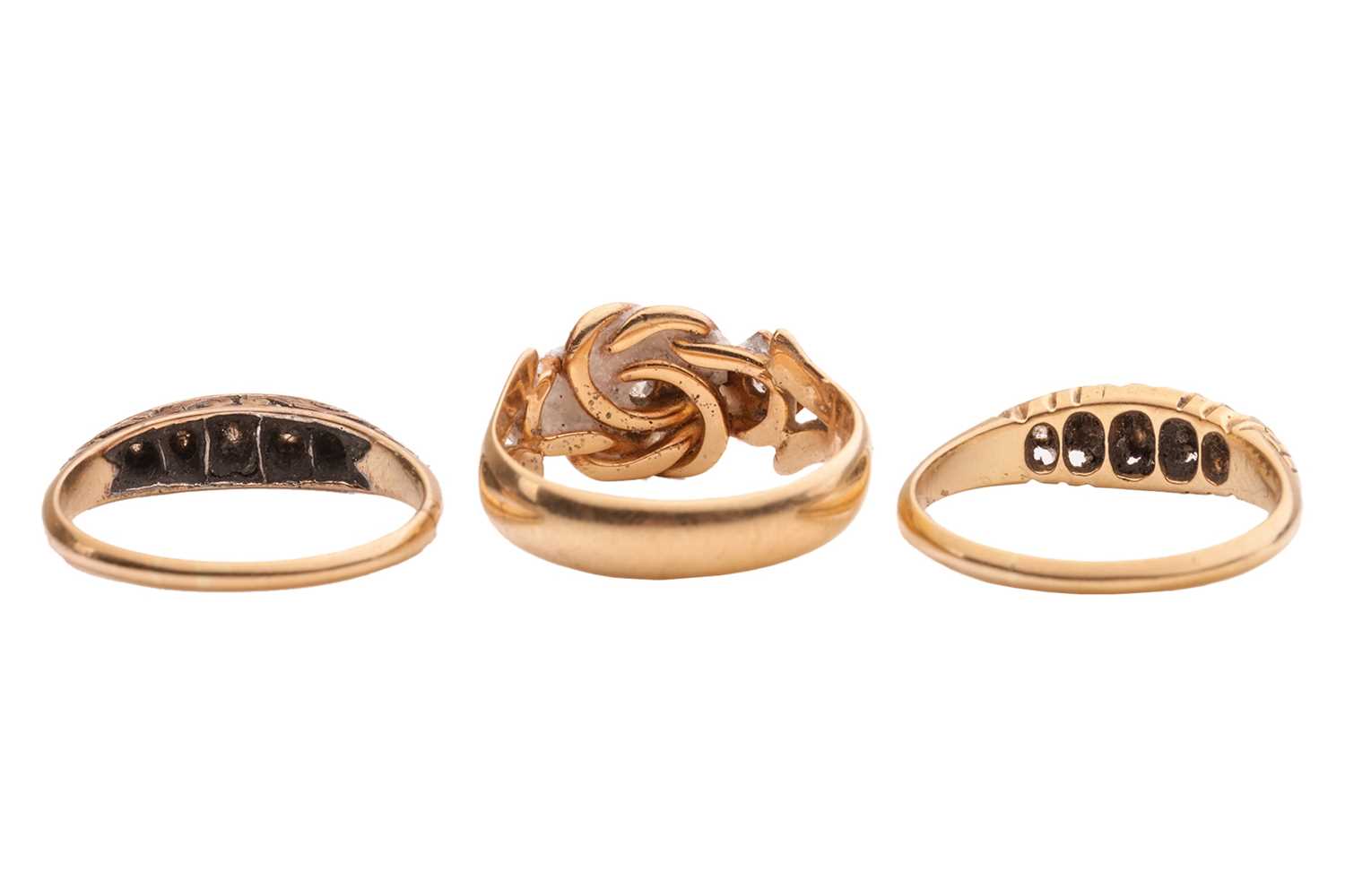 Lot 9 - Three rings; comprising a diamond-set