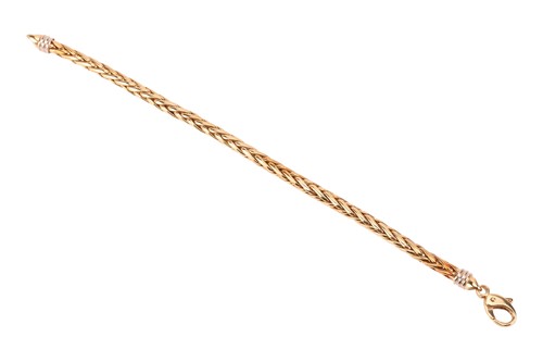 Lot 65 - A wheat link bracelet in 18ct yellow gold,...