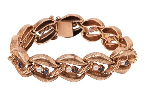 Lot A gem-set bracelet, the curved links with...