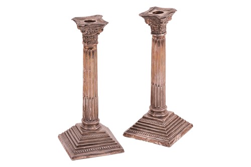 Lot A pair of Corinthian column candlesticks,...