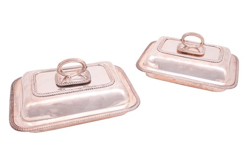 Lot A pair of silver entrée dishes, covers and...