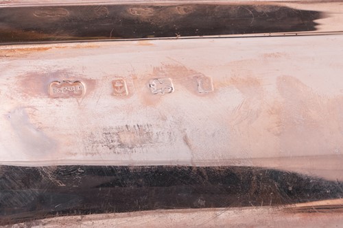 Lot A pair of silver entrée dishes, covers and...