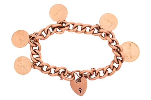 Lot A charm bracelet; featuring a chain of hollow...