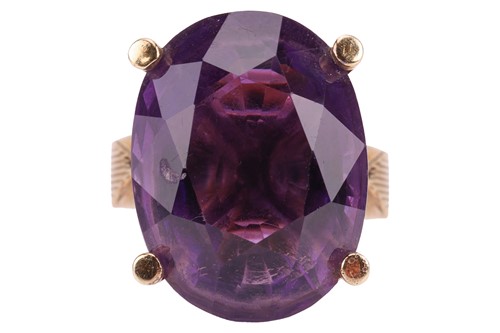 Lot An amethyst cocktail ring in 9ct yellow gold,...