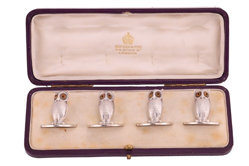 Lot 315 - A set of four novelty silver owl menu card...