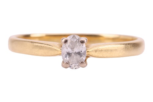 Lot A diamond solitaire ring, the central oval-cut...