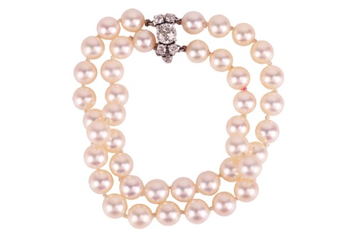 Lot 39 - A cultured pearl bracelet with diamond-set...
