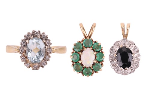 Lot 44 - An aquamarine halo ring and two gem-set...