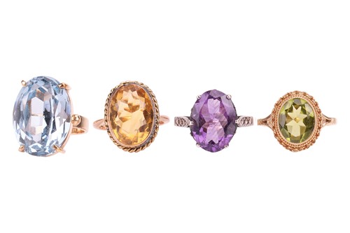 Lot 34 - A collection of four gem-set rings; to include...