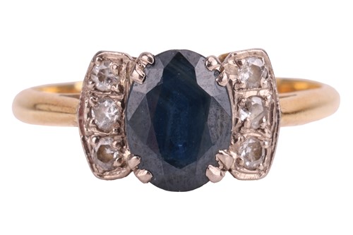 Lot 170 - A sapphire and diamond dress ring, centred...
