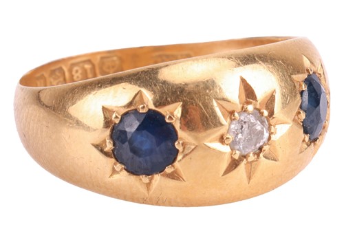 Lot 2 - A diamond and sapphire gypsy ring in 18ct gold,...