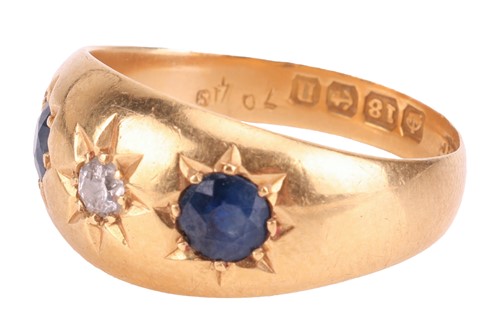 Lot 2 - A diamond and sapphire gypsy ring in 18ct gold,...