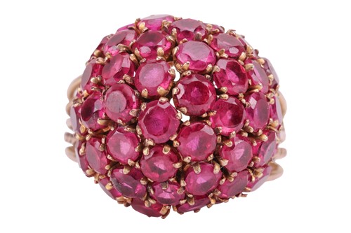 Lot 206 - A bombé ring set with synthetic rubies, the...
