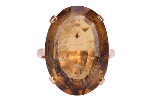 Lot 203 - A citrine cocktail ring, claw-set with a large...
