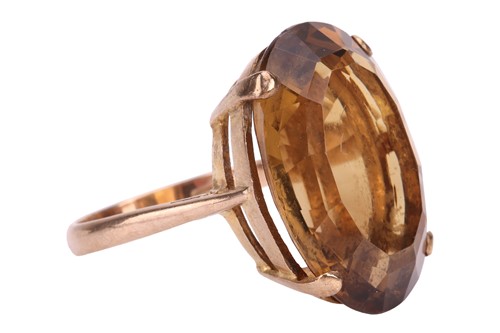 Lot 16 - A citrine cocktail ring, claw-set with a large...