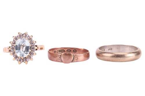 Lot 46 - Three gold rings; the first centred with a...