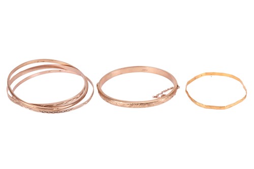 Lot 47 - A collection of five bangles; to include a...