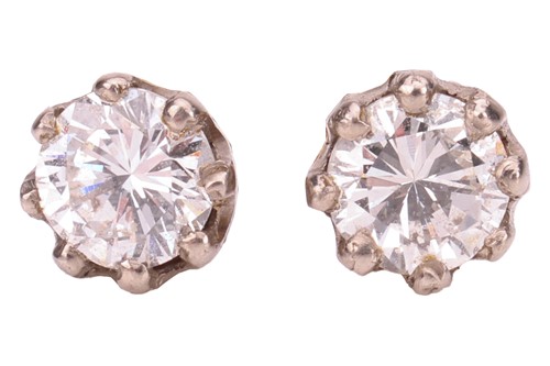 Lot 121 - A pair of diamond stud earrings, each claw-set...