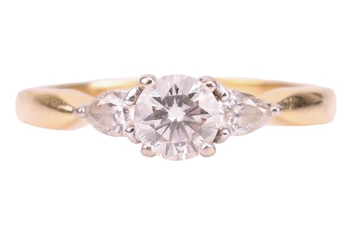 Lot 185 - A diamond trilogy ring in 18ct gold, with an...