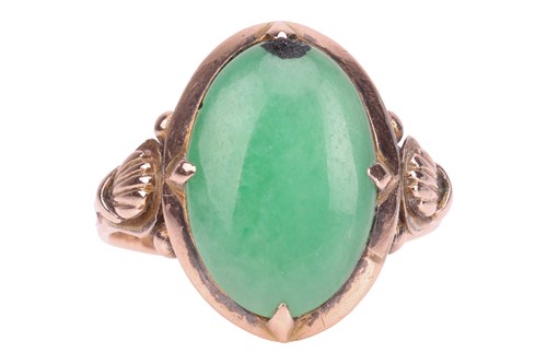 Lot 45 - A Chinese jade dress ring, centred with an...