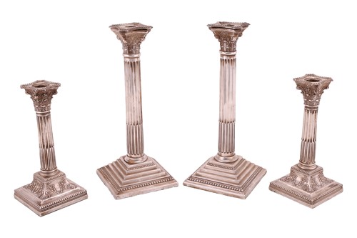 Lot 337 - Two pairs of Corinthian Column candlesticks;...