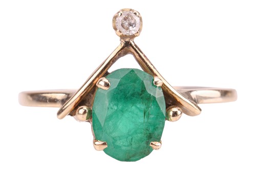 Lot 92 - An emerald dress ring, claw-set with an...