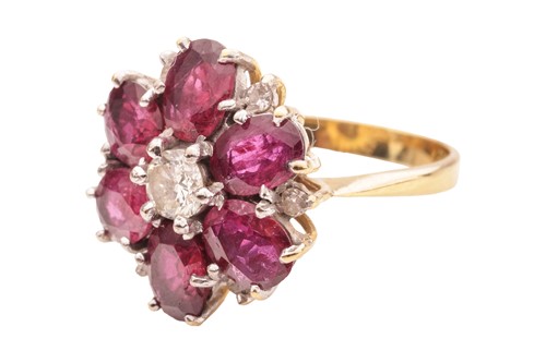 Lot 31 - A ruby and diamond floral cluster ring in 18ct...