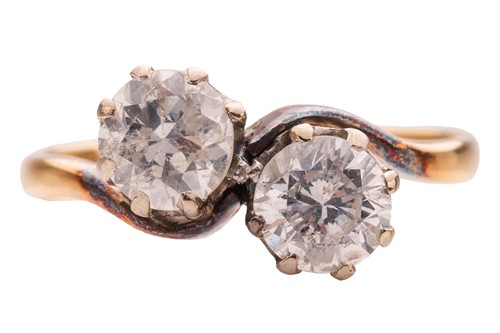 Lot 216 - A diamond Toi et Moi ring, claw-set with two...