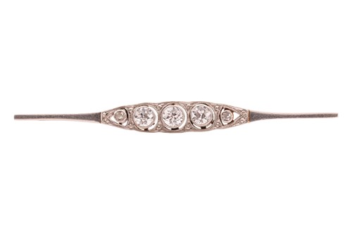 Lot 210 - An Art Deco diamond bar brooch, comprising...
