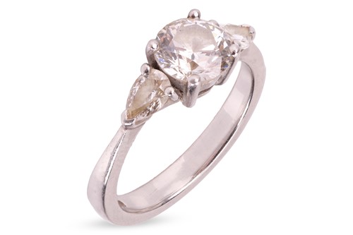 Lot 255 - A diamond trilogy ring in platinum, with an...