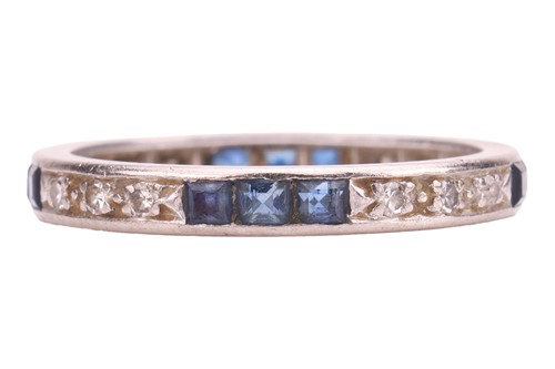 Lot 233 - A sapphire and diamond eternity ring,...