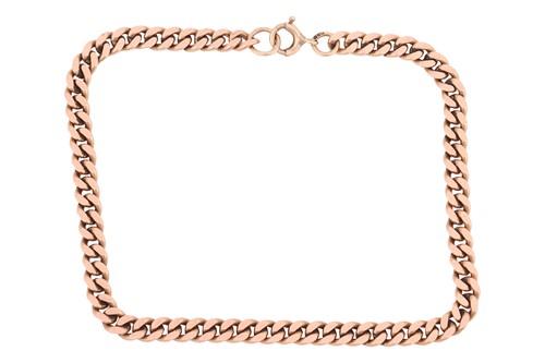 Lot A flat curb link bracelet in 9ct gold,...