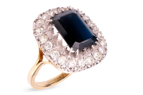 Lot A sapphire and diamond cluster ring in 18ct...