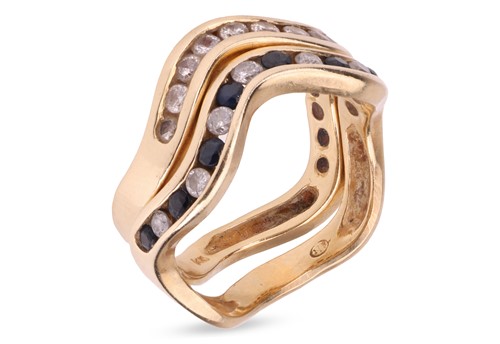 Lot 18 - Two stacking half-eternity rings, of sinuous...