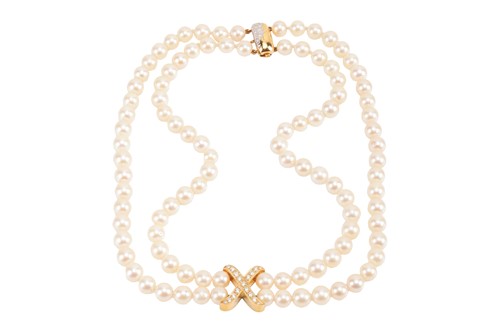 Lot 256 - A cultured pearl necklace with diamond-set...